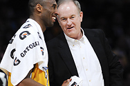 Bill chats with Kobe Bryant of the Los Angeles Lakers during a break at a game.

Courtesy AP/Wide World Photos.