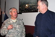 Bill interviews military men in Afghanistan.