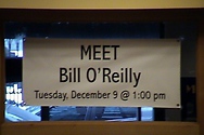 The store staff hung a banner to welcome Bill and to announce the event to store patrons.