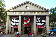 Banners for the Fox News Channel fly outside Quincy Market across from Faneuil Hall.