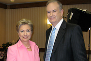 Bill poses for a quick photo with Senator Clinton following his interview.
